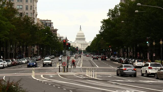 Looking down Pennsylvania Avenue towards the Capitol building in Washington D.C. Timelapse.