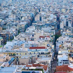 Aerial shot of the neighborhood of Neos Kosmos in Athens, Greece wiith buildings and roofs © Wirestock