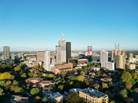 Aerial view of a  cityscape featuring a towering skyscraper under the blue sky in CityScape, Croydon