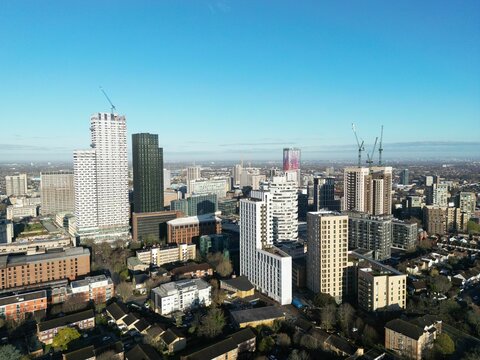 Aerial view of a  cityscape featuring a towering skyscraper under the blue sky in CityScape, Croydon