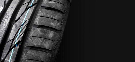 New car tires with colored lines on the tread , car tyre horizontal banner with copy space on the...