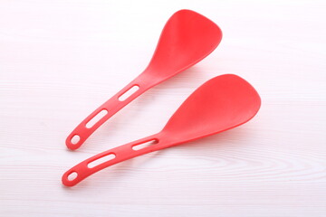 red cooking utensils on a bright background
