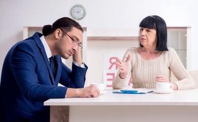 Male real estate agent and female client in the apartment