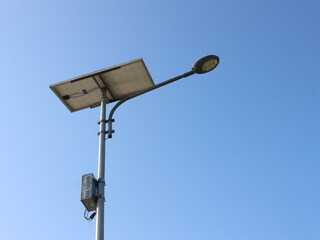 Solar cell lights. Natural photo of a solar powered street lamp with a bright blue sky background
