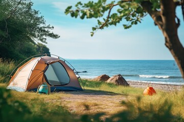 Camping on the beach at sunset. view of a camping tent on a summer evening.