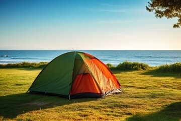 Camping on the beach at sunset. view of a camping tent on a summer evening.