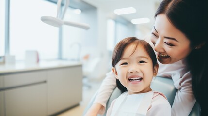 happiness cute girl and dentist for checkup and treatment of teeth at clinic, Smiling girl on bed at dentist clinic