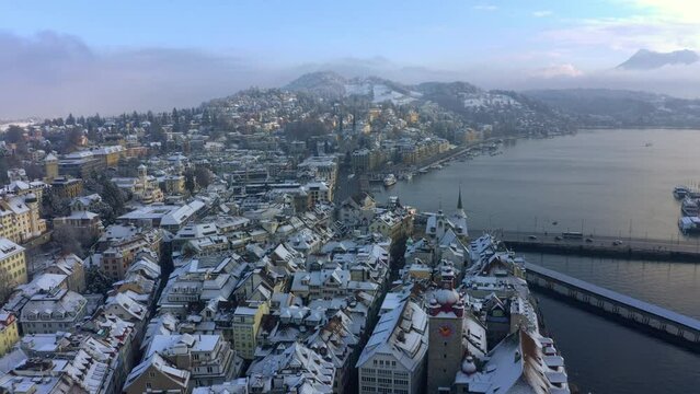 Drone Shot of Lucerne Switzerland, Idyllic Late Winter Scenery, Bridge Traffic and Snow Capped Buildings