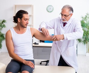 Young male patient visiting experienced doctor