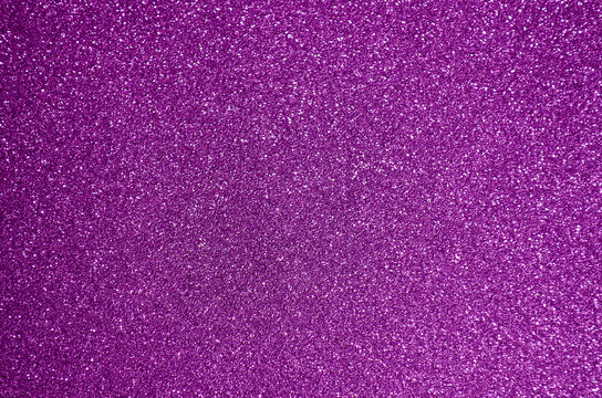 Fondo de brillos / textura glitter de color fucsia / rosa/morado. Se puede usar como fondo de celebraci&oacute;n o decoraci&oacute;n fiesta.