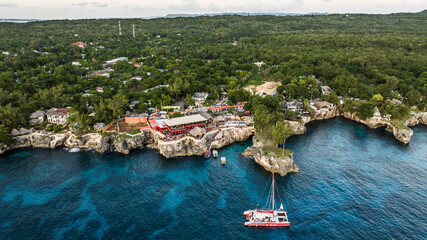 Negril, Jamaica, aerial landscape view of area around the famous Rick's Cafe in Negril, with boats...