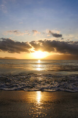 Beautiful golden sunrise, sands and blue sky on the beach.