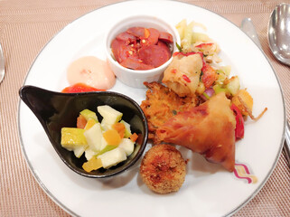 A well decorated platter of delicious snacks