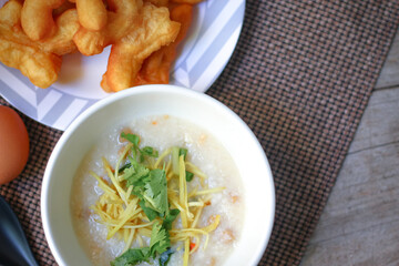 Hot Chinese pork congee, Pork congee often served with deep fried dough stick for breakfast.