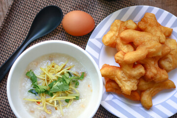 Hot Chinese pork congee, Pork congee often served with deep fried dough stick for breakfast.
