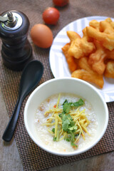 Congee and fresh ginger on top.
