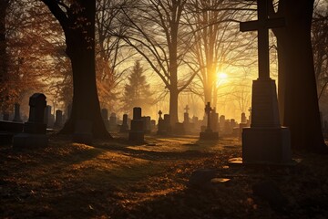 Gravestones in a cemetery at sunrise