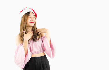 young asian woman wears pink shirt and christmas red santa claus hat isolated white background