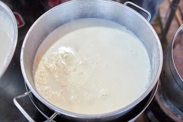 Close-up of soy bean milk in pot 