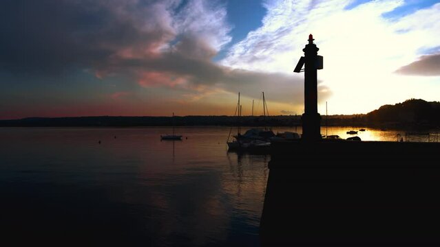 Angera Italy, the charm of the lighthouse at sunset