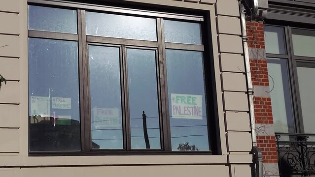 View of Free Palestine Signs on Window in Brussels, Belgium