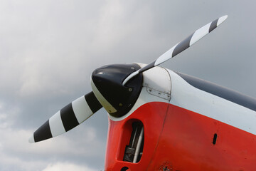A red light aircraft. Fragment of a propeller of the front part of . Close-up, screws, texture, surface