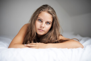 Fototapeta premium House, woman portrait and bed with sleeping, rest and relax in a bedroom with face and calm. Dreaming, female person and confidence with nap at home on a blanket and sheets lying down with thinking