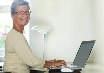 Mature woman, laptop and portrait for freelance, office and company, remote work and technology....