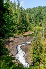 Fototapeta na wymiar Waterfalls and forest scenery at Elk Falls Park, BC, Canada 