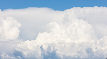 White clouds on a blue sky as a background