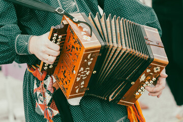 A man plays the accordion. Close-up