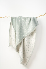 Muslin baby blanket on white background studio shot