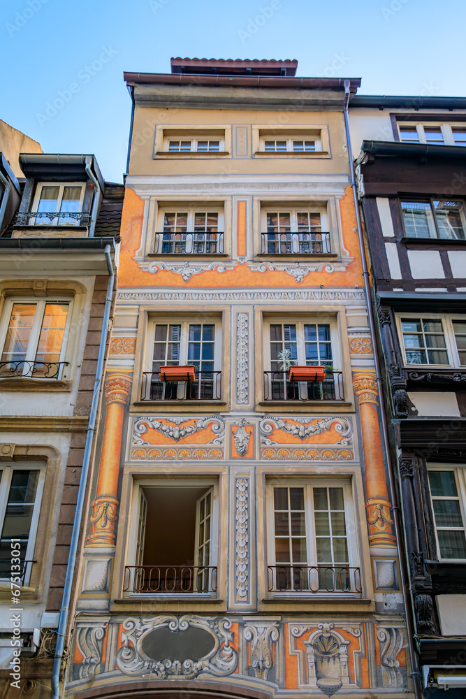 Wall mural ornate traditional baroque house with frescoes on the facade in the grande ile, the historic center 