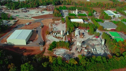 Aerial video of ready mix concrete supplier, location Atlanta, Georgia. Concrete trucks, flow of building material to city's construction projects.