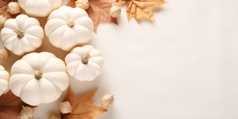 Fototapeta na wymiar Autumn cozy composition with white pumpkins, autumn leaves on white background.