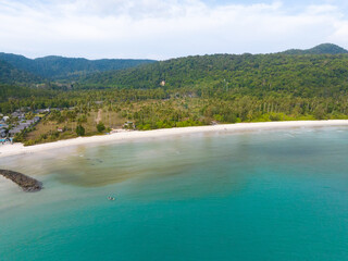 Aerial drone view of beautiful beach with turquoise sea water and palm trees of Gulf of Thailand. Kood island, Thailand.