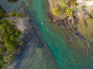 Aerial drone view of beautiful beach with turquoise sea water and palm trees of Gulf of Thailand. Kood island, Thailand.