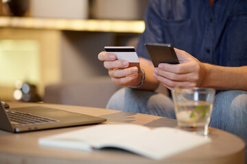 Hands of startupper paying for service with credit card