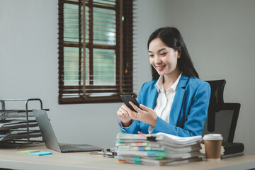 Businesswoman is talking on the phone with a partner, Businesswoman is sitting and working in the office, An entrepreneur is talking on the phone with a company customer, office idea.