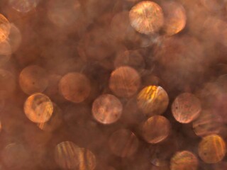 Naklejka premium Golden light twinkling bokeh effect background 