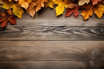 Naklejka na ściany i meble Autumn leaves on wooden background. copy space