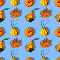 seamless pattern different pumpkins on a blue background