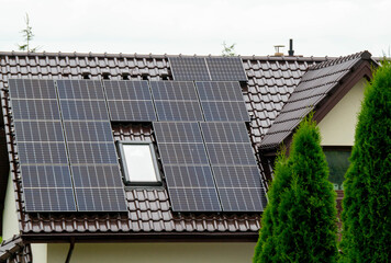 Historic farm house with modern solar panels on roof and wall