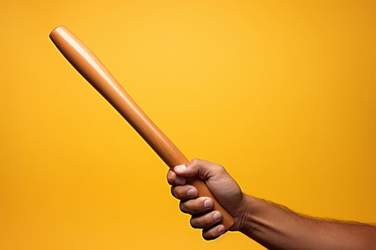 Close-up of a hand holding a baseball bat