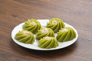 Kue Kaswi Pandan, traditional cake made from tapioca flour and pandan leaf, topping with sesame seed
