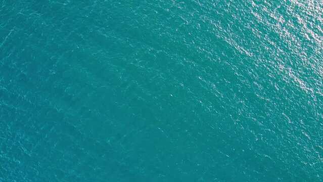 Aerial drone top down shot over blue Caribe sea and Mayan Riviera confluence close to Cancun city, Quintana Roo state, Mexico on a sunny day.