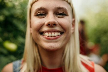 Portrait of a smiling young blond woman.