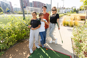 Kids playing golf inside playground artificial grass activity game for children 