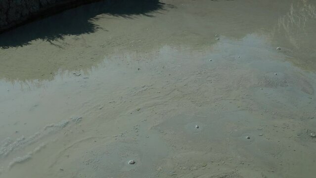 Mud volcano, mud dome is a landform created by the eruption of mud or slurries, water and gases. Several geological processes. Air or gas bubbles burst on the surface of the therapeutic clay. Temryuk