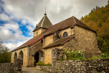 Fototapeta premium Church of La Asunción from the 16th century of Izalzu in the Navarrese Pyrenees in Navarra, Spain with beautiful sky with clouds